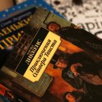 Close-up of Ukrainian versions of classic literature, including 'Oliver Twist' by Charles Dickens.